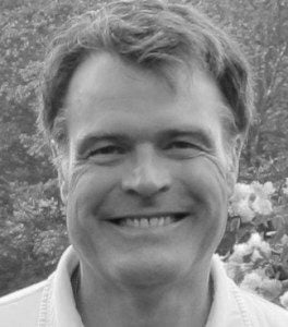 Black and white headshot of author Reed Karaim