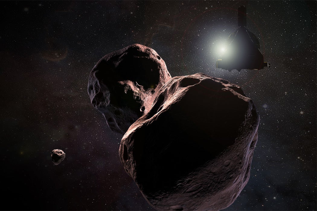 Space rocks floating in space as a spacecraft shines a light towards them