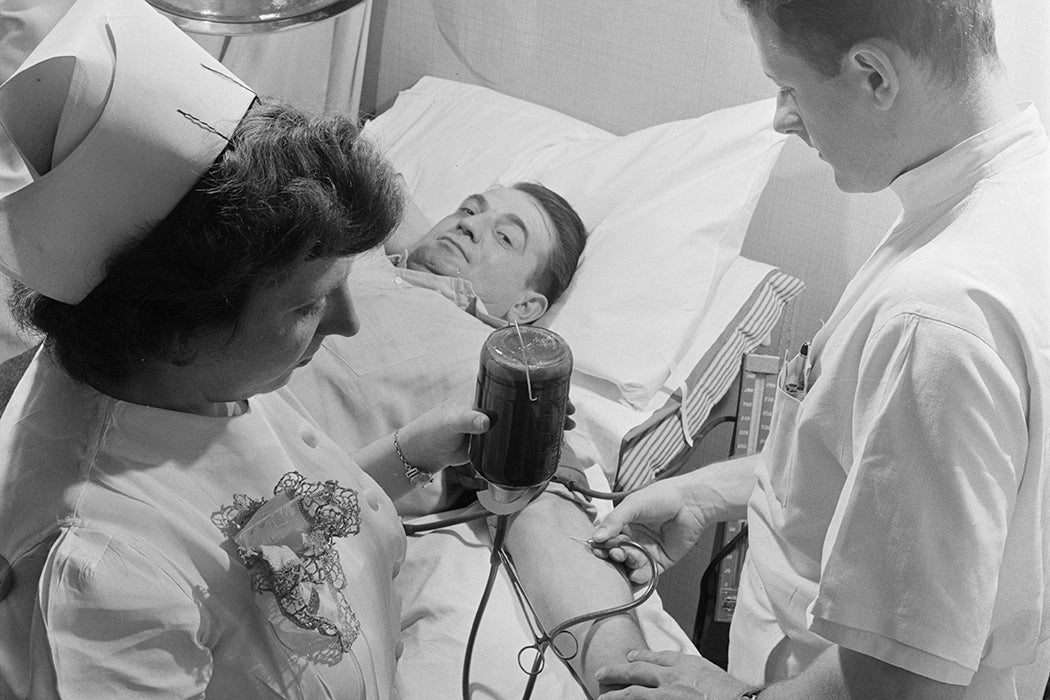 Medical staff taking blood from a blood donor at the Princeton Medical Center in New Jersey, USA, circa 1950.