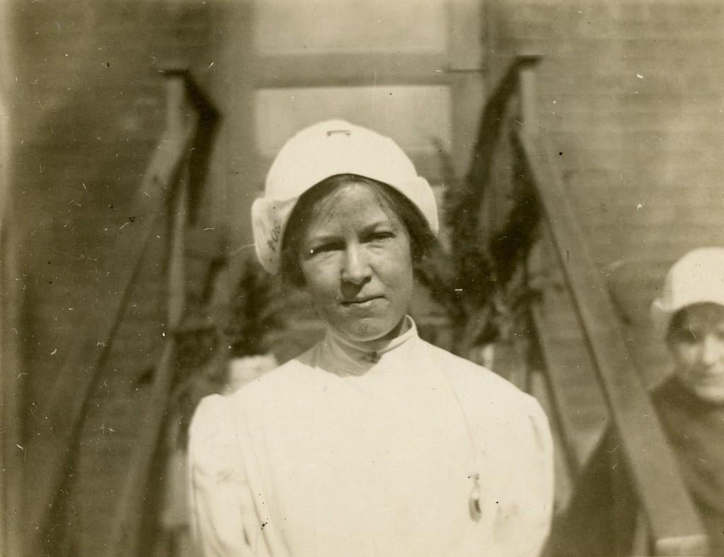 An unidentified nurse poses for a portrait, early 1900s