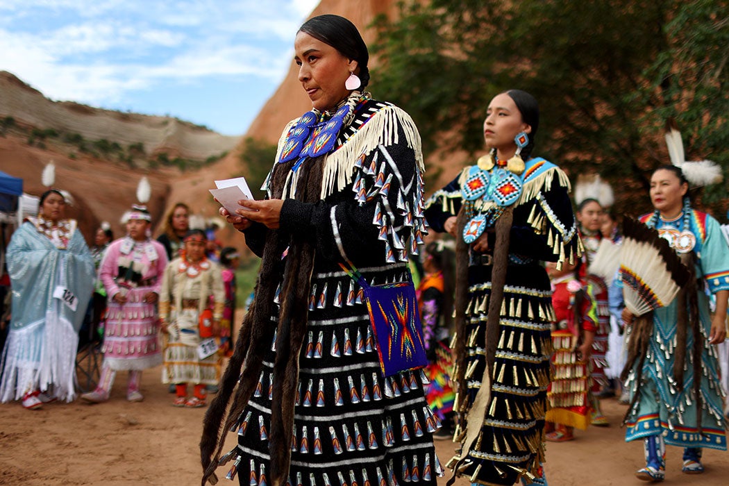 Dancers prepare to enter the contest powwow at the 100th Gallup Inter-Tribal Indian Ceremonial at Red Rock Park on August 13, 2022